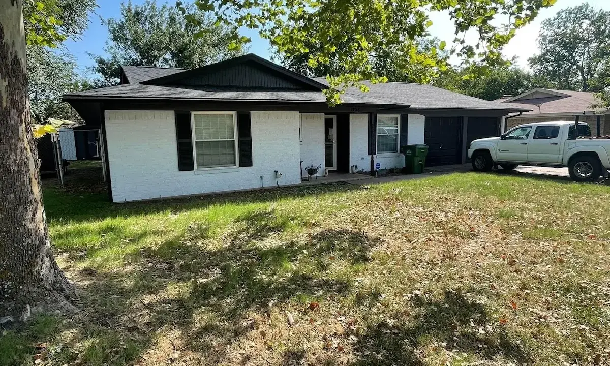 Professional roofing crew working on a residential roof in Sussex